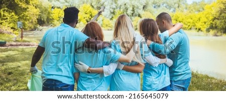 Volunteering, people and ecology concept. Group of volunteers embracing in park, back view, copy space



 Royalty-Free Stock Photo #2165645079