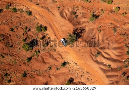 Expedition with offroad car in a desert - Overlanding through the sand dunes Royalty-Free Stock Photo #2165658329