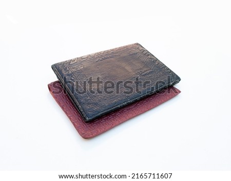 Two old men's wallets on a white background