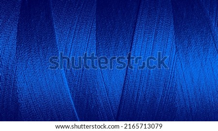 Close up texture picture of sew thread blue color , macro background Royalty-Free Stock Photo #2165713079