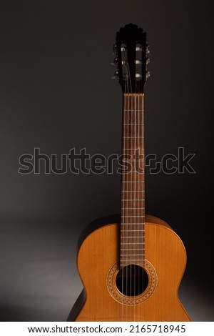 Classical guitar on grey background with copy space