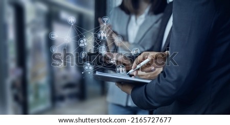 Selective focus hands of business team meeting and working together with customer connection interface icons in the office, Business new start up and Modern technologies for connection concept. Royalty-Free Stock Photo #2165727677