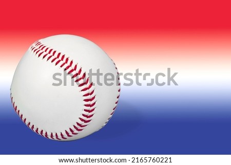 Baseball with a shallow depth of field isolated on a red white and blue gradient with copy space