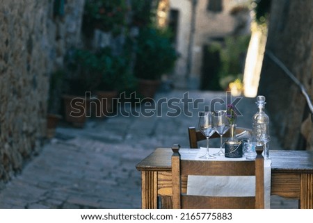 table of an Italian restaurant in the heart of Tuscany in val dorcia  Royalty-Free Stock Photo #2165775883