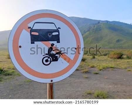 Sign no Car and no Motorcycle against blurred background