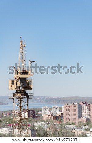 crane at construction site panorama of city. unfinished building, building under construction. panorama of city, construction of high-rise building russia