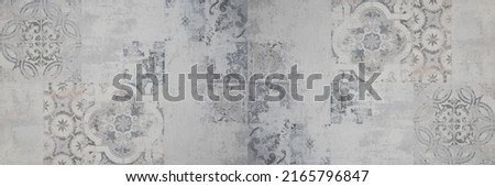 Old gray grey white vintage retro worn geometric arabesque shabby mosaic ornate patchwork motif porcelain stoneware tiles stone concrete cement wall texture background panorama Royalty-Free Stock Photo #2165796847