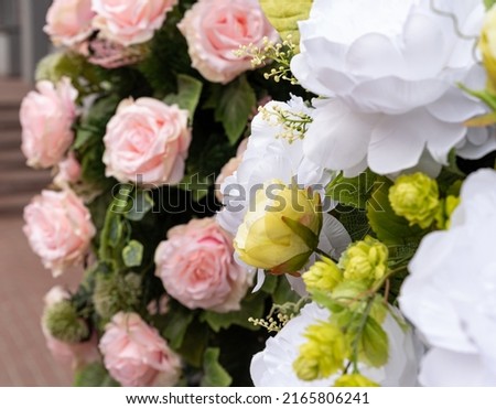 Artificial flowers in pastel colors. A bunch of artificial flowers. Ever-blooming bouquet.