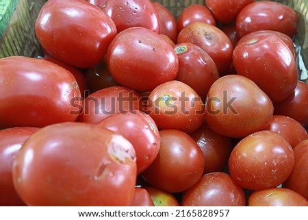 Red tomatoes that are in the basket, contain nutrients that are good for the body. Royalty-Free Stock Photo #2165828957