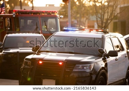 Police, fire, and paramedic units respond to the scene of an emergency. Royalty-Free Stock Photo #2165836143