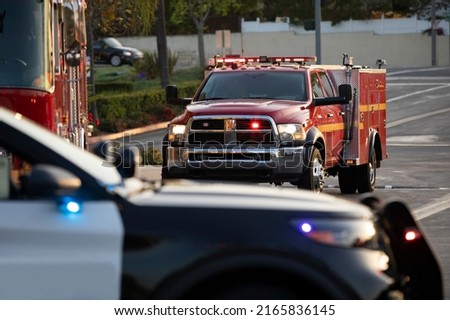 Police, fire, and paramedic units respond to the scene of an emergency. Royalty-Free Stock Photo #2165836145