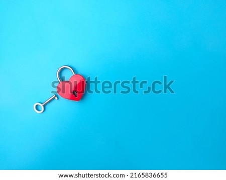 Heart shaped red lock with key. Concept of love forever with padlock.