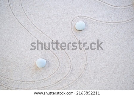 Calm Nature  Japan Concept,Zen Garden Japanese Pattern on Beach Background,Design Buddhism Texture Wave on Desert ,Top View Line Abstract on Sand with Stone,Purity Meditation Balance or Aroma Spa.