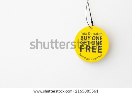 buy one get one free yellow tag on white background