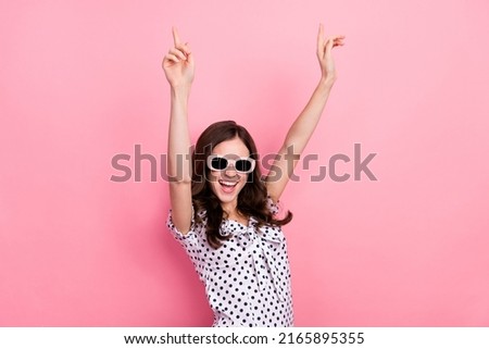 Photo of sweet excited woman wear white dress dark glasses having fun isolated pink color background