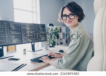 Profile side picture of positive business lady working hard writing scripts coding working online indoors in office