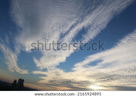 Altocumulus clouds are full of streaks of beautiful usually appear between lower stratus clouds and higher cirrus clouds photographed over at Thailand. Royalty-Free Stock Photo #2165924895