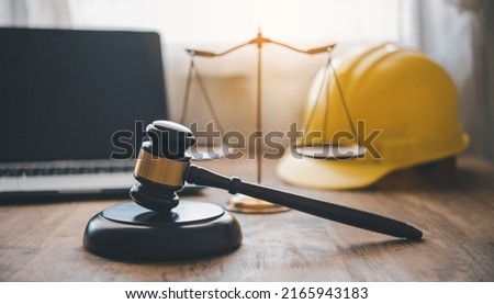 Judge's hammer and helmet Law and Justice about labor law concept Construction law. Royalty-Free Stock Photo #2165943183