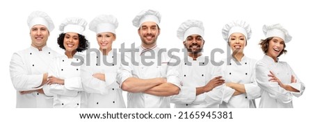 cooking, culinary and profession concept - international team of smiling chefs with crossed arms Royalty-Free Stock Photo #2165945381