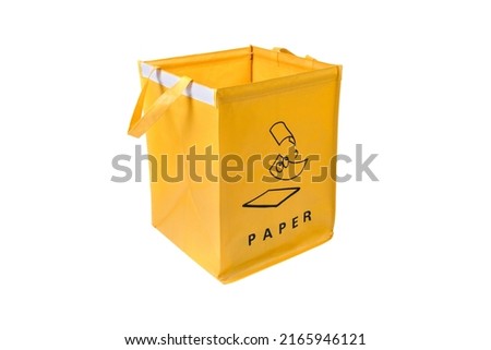 Yellow bag for collecting garbage paper. A box for used cardboard on a white background. Conservation of the surrounding nature through recycling.