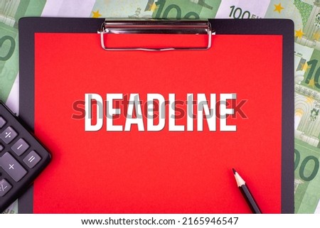 DEADLINE - word on the background of money, a notepad and a pencil with a calculator. Business concept (copy space).