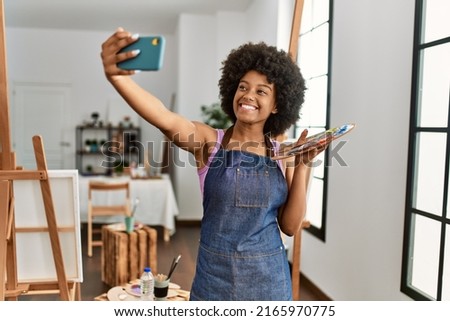 Young african american woman smiling confident make selfie by the smartphone at art studio