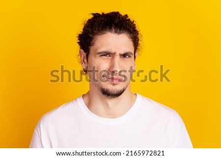 Photo of young latin man unhappy negative moody dislike bad spoiled isolated over yellow color background