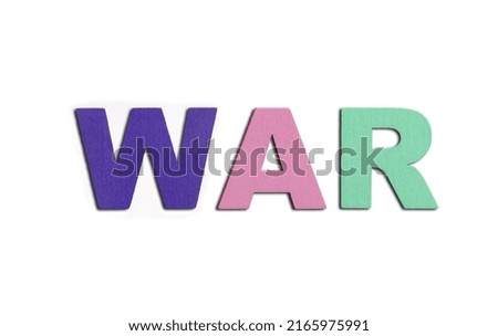 WAR, word written in colorful wooden alphabet letters on red background. The concept of a military conflict destroying country. Top view. Copy space