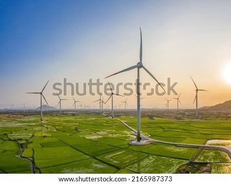 Landscape with Turbine Green Energy Electricity, Windmill for electric power production, Wind turbines generating electricity on rice field at Phan Rang, Ninh Thuan, Vietnam. Clean energy concept. Royalty-Free Stock Photo #2165987373