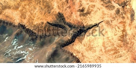 abstract landscape photo of the deserts of Africa from the air emulating the shapes and colors of the children of the volcano, Genre: Abstract naturalism, from the abstract to the figurative