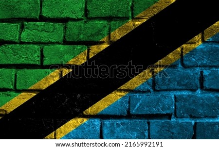 Flag of Tanzania. Brick wall texture of the flag of Tanzania.