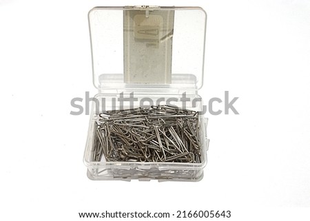 Stacks of paper clips in a box Royalty-Free Stock Photo #2166005643