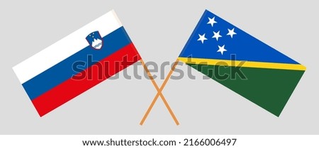 Crossed flags of Slovenia and Solomon Islands. Official colors. Correct proportion. Vector illustration

