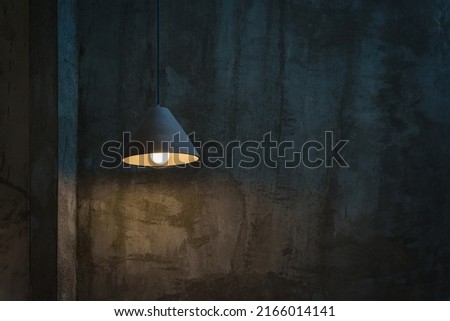 Beautiful modern ceiling lamp lights bulbs triangular shape decoration on cement wall loft-style with space for text by vintage mood toning color. Contemporary interior for office building concept. Royalty-Free Stock Photo #2166014141