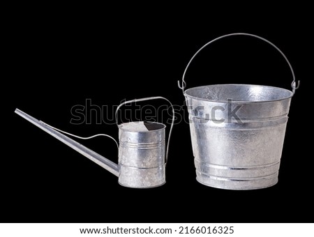 Aluminum watering can and Metal Bucket, Isolated on black background