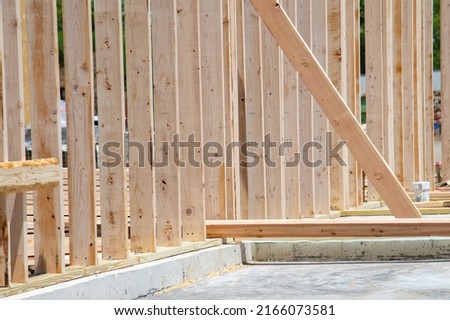Construction framing in wood, buildings and houses new material residental Royalty-Free Stock Photo #2166073581