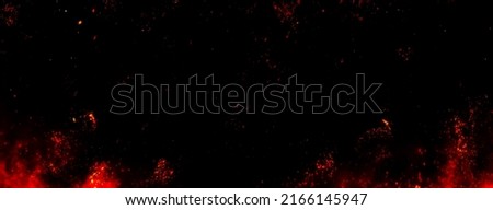 Fire embers particles over black background. Fire sparks background. Abstract dark glitter fire particles lights. bonfire in motion blur. Royalty-Free Stock Photo #2166145947