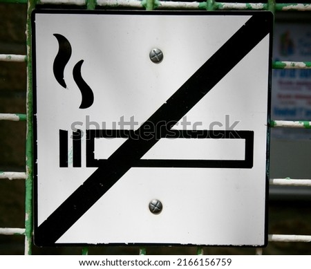 An old sign in the town centre, forbidding people from smoking, Coutances, Normandy, France, Europe