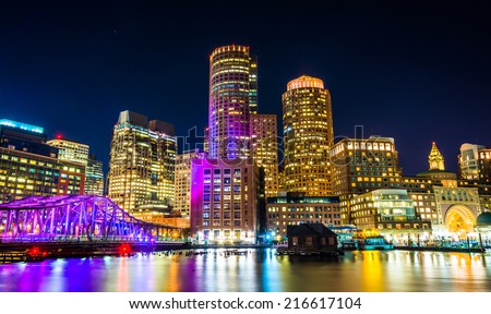 The Boston skyline and Fort Point Channel at night from Fan Pier Park, Boston, Massachusetts.