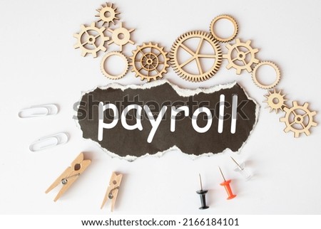 White paper with text PAYROLL isolated on blue background.