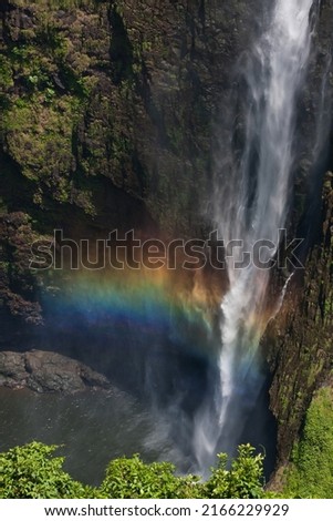 Rainbow waterfall amid dramatic scenery. Tad Fane Waterfall the natural attraction of the Bolaven Plateau, Paksong District, Champasak Province, Laos.