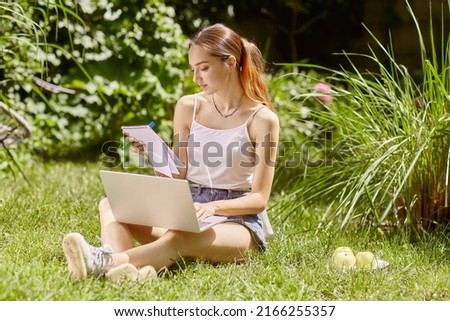 girl holding an online meeting and chat in nature