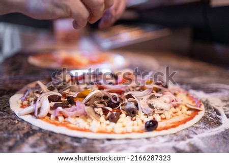 Making pizza in italiajn restaurant