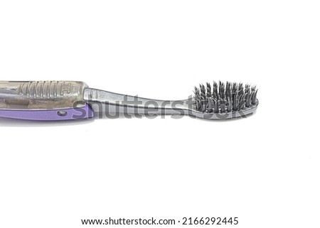 Toothbrush is a tool used to remove plaque and food residue on teeth Royalty-Free Stock Photo #2166292445