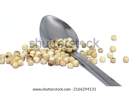 pepper spilled from a spoon.  ingredients that are often used in traditional or modern food Royalty-Free Stock Photo #2166294131