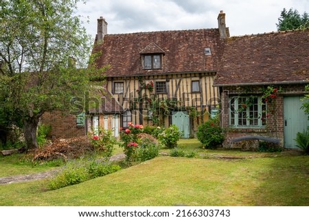 Tourist destination, one of most beautiful french villages, Gerberoy - small historical village with half-timbered houses and colorful roses flowers, France Royalty-Free Stock Photo #2166303743