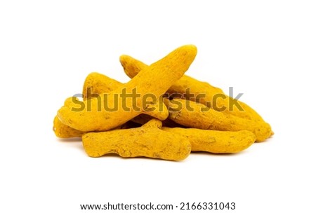 Turmeric root and powder on a white background close-up isolated. Useful spices, Indian roots and herbs. Medicinal folk ingredients for food. Royalty-Free Stock Photo #2166331043