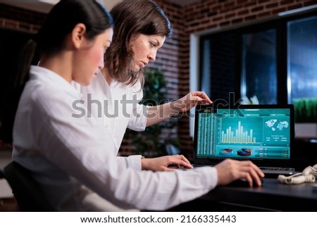 Marketing agency employees discussing about bankruptcy while analyzing financial data on laptop screen. Business company office workers sitting at desk while reviewing startup project state.