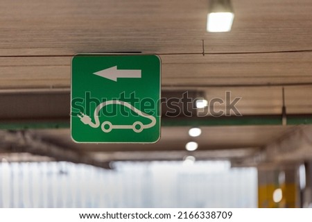 Electric car charging sign in the parking lot. High quality photo