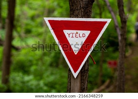 One outdoor red and white yield sign on a a trail in Missouri Valley, Iowa